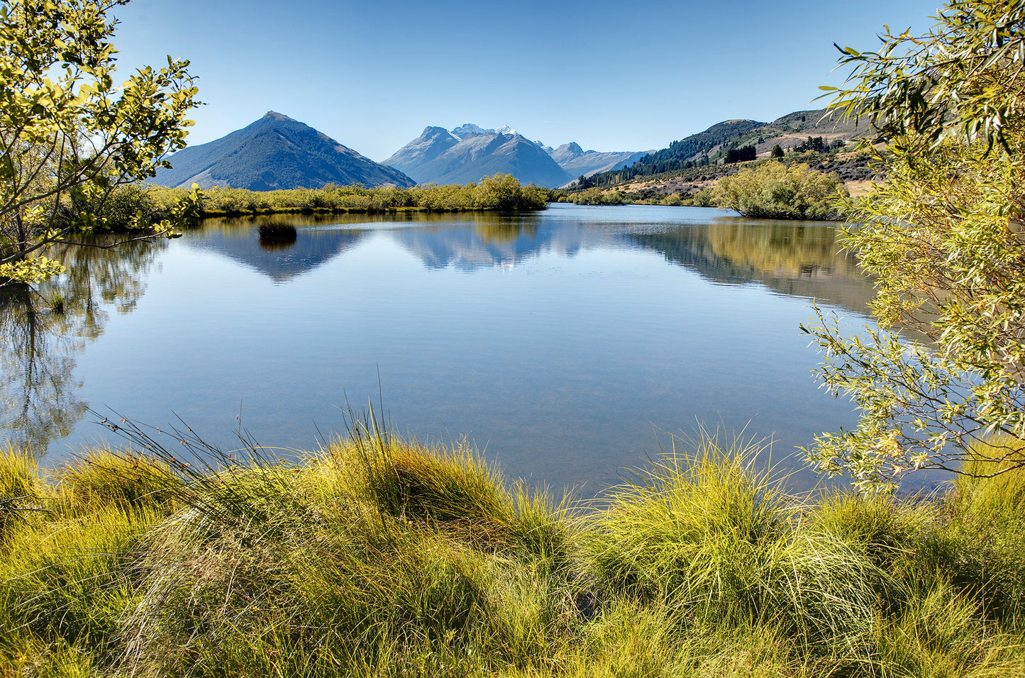 Mirror reflections of Humboldt Mountains on Glenorchy Lagoon scenic walk
