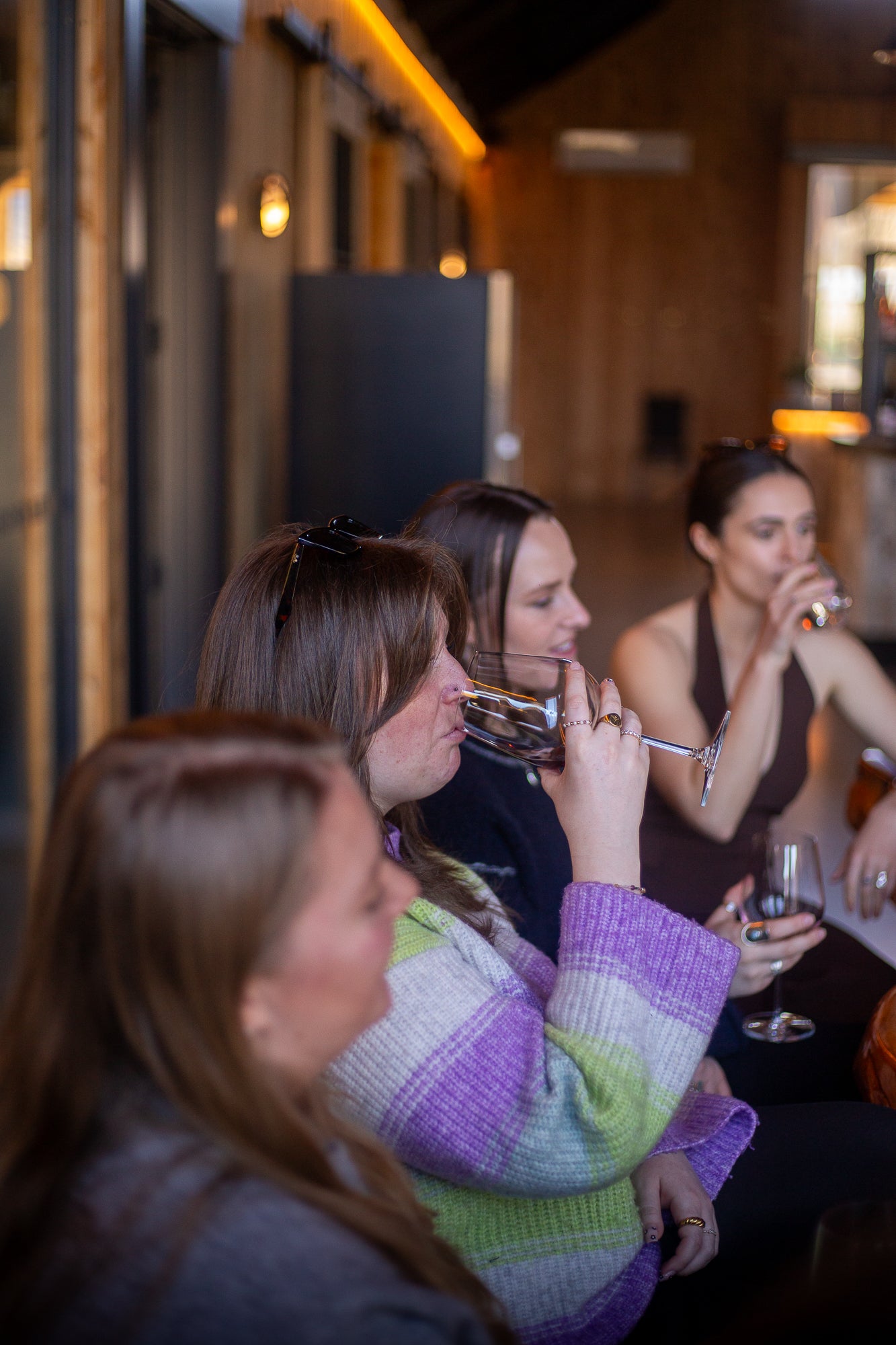 Guests enjoying a private wine tasting session at a boutique Gibbston Valley winery