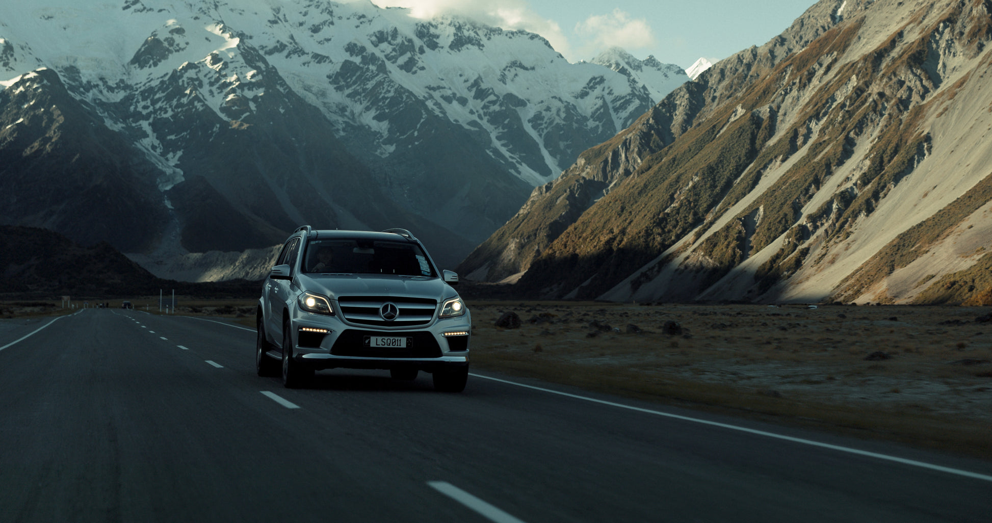 Luxury Mercedes vehicle driving towards Aoraki Mount Cook on private tour