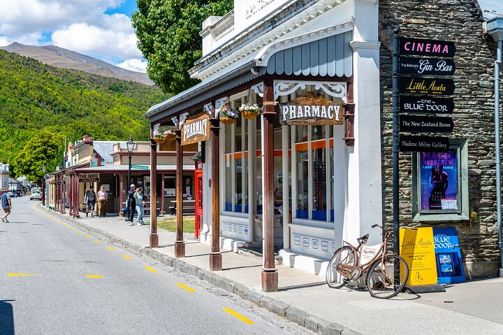 Arrowtown main street with historic buildings and boutique shops on a sunny day